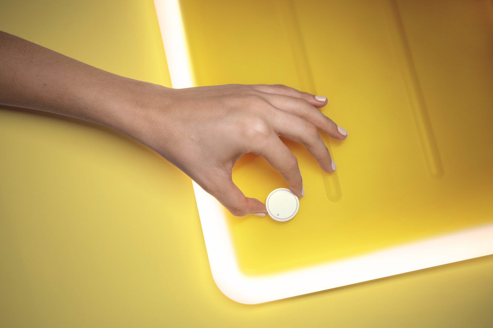 Hand placing coin representing sales performance metrics and revenue tracking for business growth